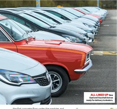  ??  ?? ALL LINED UP New Opel and Vauxhall Astras ready for delivery to dealers.