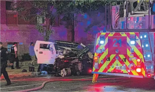  ?? ANDY BOYLE/SUN-TIMES ?? A woman was killed Wednesday when her SUV was struck by a Chicago police car involved in a pursuit.