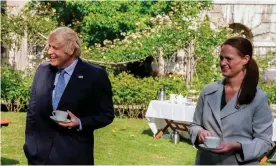  ??  ?? An image released by 10 Downing Street shows Boris Johnson and Jenny McGee in the gardens of 10 Downing Street in July 2020. Photograph: Andrew Parsons/10 Downing Street/ AFP/Getty Images