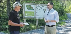  ?? HANNAH RUDDERHAM/CAPE BRETON POST ?? Derek Mombourque­tte met with David Gabriel, president of the Baille Ard Trails Associatio­n, at the Baille Ard Nature Trail on Friday to announce the $17,000 grant for upgrades to the park.