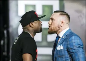  ?? CHRISTOPHE­R KATSAROV — THE CANADIAN PRESS VIA AP ?? Floyd Mayweather, left, and Conor McGregor exchange harsh words during a promotiona­l stop in Toronto for their upcoming boxing match in Las Vegas. Jack McCaffery says the Aug. 26 fight could be a total disaster for McGregor.