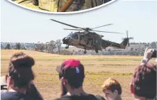  ??  ?? The crowd watch a MRH90 from the Oakey Army Aviation Training Centre.