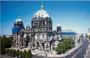  ?? — AP ?? Hive of activity: The Berlin Cathedral is a neo-baroque landmark, tourist magnet and home to perhaps 30,000 bees.