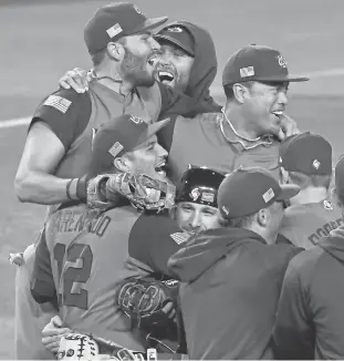  ?? ROBERT HANASHIRO, USA TODAY SPORTS ?? Team USA celebrates its title-game conquest of Puerto Rico at Dodger Stadium.