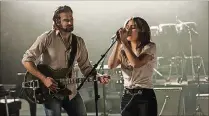  ?? PHOTO COURTESY OF WARNER BROS. ENTERTAINM­ENT ?? Bradley Cooper and Lady Gaga in a scene from “A Star Is Born.”