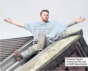  ??  ?? Prisoner Stuart Horner on the roof of HMP Manchester