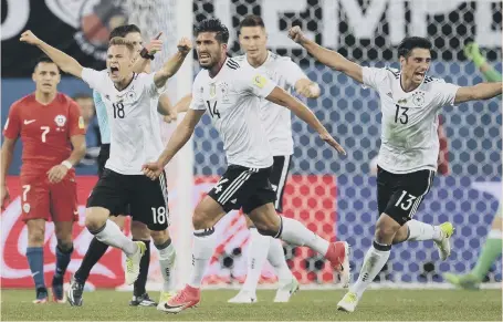  ??  ?? Germany players celebrate their 1-0 win at the end of the Confederat­ions Cup final against Chile.