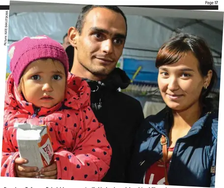  ?? Picture:KATEBAKLIT­SKAYA ?? Freedom: Refugees Polad, his pregnant wife Liudmyla and daughter Milana, two