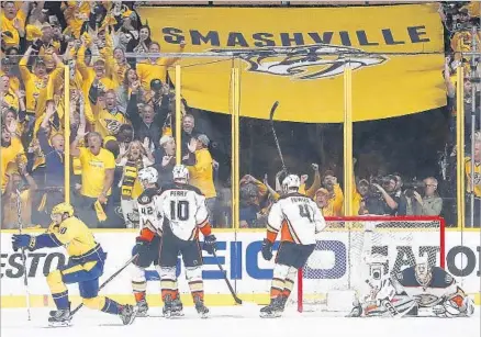  ?? Photograph­s by Robert Gauthier Los Angeles Times ?? PREDATORS CENTER Colton Sissons, left, celebrates after beating Ducks goalie Jonathan Bernier in first period. He would score twice more in the third period, completing his hat trick with the goal that put Nashville ahead for good, 4-3, with six...