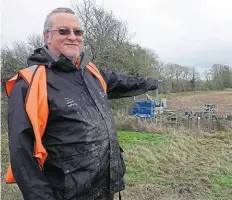  ?? ?? Terry Cavender, trustee and executive officer of the Buckingham Canal Society, points to where the diversion of the canal will probably take place.