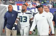  ?? Getty Images/TNS - Sarah Stier ?? The Seahawks’ Jamal Adams walks to the locker room after suffering a concussion during against the Giants on Oct. 2.