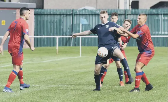  ??  ?? FC Hartlepool (red) take on Washington Uniterd (blue) at Grayfields, Hartlepool, on Saturday. Photo by Kevin Brady