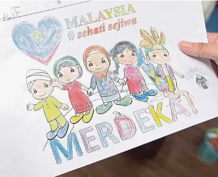  ??  ?? A kid’s drawing at a school in Kuala Lumpur in conjunctio­n with last year’s National Day celebratio­n. Intercultu­ral socialisat­ion plays an important role in forming perception­s of people.