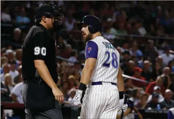  ?? ASSOCIATED PRESS ?? ARIZONA DIAMONDBAC­KS’ STEVEN SOUZA JR. (28) argues with umpire Mark Ripperger (90) after Souza was called out on strikes during the fourth inning of a baseball game against the Washington Nationals on Thursday in Phoenix.