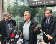  ??  ?? David Trapp, centre, was unsuccessf­ul as the representa­tive plaintiff in a lawsuit aimed at the B.C. Liberals. He was represente­d by lawyers David Fai, left, and Paul Doroshenko.