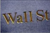  ?? MARK LENNIHAN — THE ASSOCIATED PRESS FILE ?? U.S. stocks rose to record highs Tuesday as banks kept rising and retailers climbed after some encouragin­g job data.