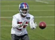  ?? SETH WENIG — ASSOCIATED PRESS ?? Giants’ Eli Apple catches a ball during practice in East Rutherford, N.J., last April.