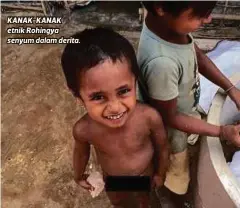  ??  ?? KANAK-KANAK etnik Rohingya senyum dalam derita.