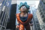  ?? AP PHOTO/TINA FINEBERG ?? The Goku balloon makes its way down New York’s Sixth Avenue during the 92nd annual Macy’s Thanksgivi­ng Day Parade, Thursday, Nov. 22, 2018, in New York.