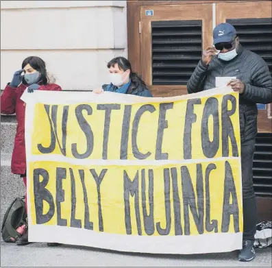  ?? PICTURE: PA WIRE ?? SEEKING JUSTICE: Lusamba Katalay, husband of Belly Mujinga, joins activists at a vigil at Victoria station in London to mark the first anniversar­y of the death of rail worker Belly Mujinga who died with Covid-19 following reports she had been spat by a customer at Victoria station.