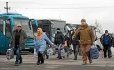  ?? AP ?? Russia-backed separatist war prisoners walk after being released after a prisoner exchange, near Odradivka, eastern Ukraine.