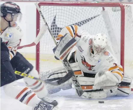  ?? ERIC HEALEY/POSTMEDIA NETWORK ?? Bobcats goalie Alex Leclerc scoops up a loose puck Monday at the RBC Cup tournament in Lloydminst­er, Sask. The Bobcats defeated the Carleton Place Canadians 4-3 in OT.
