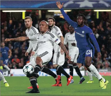  ?? Picture: NEIL HALL, EPA ?? MIXING IT WITH THE BIG BOYS: Dino Ndlovu has brushed shoulders with Chelsea and Roma in the Champions League this season.