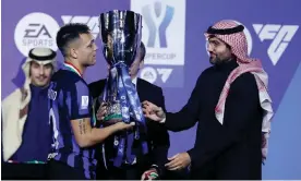  ?? ?? Lautaro Martínez of Internazio­nale receives the trophy during the Italian Supercup Final match at Al-Awwal in Riyadh, Saudi Arabia. Photograph: DeFodi Images/Getty Images