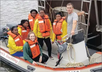  ?? PICTURE: FRED KOCKOTT ?? SeaQuest’s Nina Hoffman, front, and Thor Erickson, right, have helped train five uMlazi tourism graduates to be WhaleTime guides. They are, from left, Nokuthula Ngwane, Nombuso Nzama, Thandeka Ziqubu, Nondumiso Chilli, Bongiwe Mthethwa.