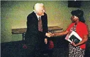  ??  ?? Oklahoman Religion Editor Carla Hinton meets Billy Graham in 2003.