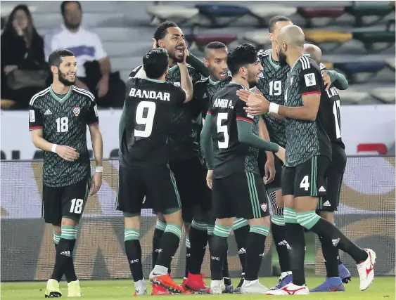  ?? Pawan Singh / The National ?? Khamis Esmail, third from left, and his UAE teammates celebratin­g after scoring the first goal against Kyrgyzstan yesterday in Abu Dhabi