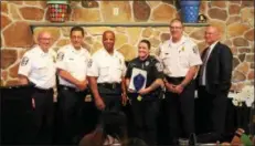  ?? OSCAR GAMBLE — DIGITAL FIRST MEDIA ?? Norristown Police Officer Samantha O’Neill, holding award, is congratula­ted by, from left, Lt. Ken Lawless, Lt. Michael Bishop, Chief Mark Talbot Sr., Capt. Richard Clowser and Lt. Todd Dillon for her role in helping to save the life of a shooting victim at the Norristown Police Appreciati­on Dinner and Awards Ceremony at Elmwood Park Zoo, Tuesday, June 11.