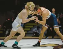  ?? JANE THERESE/SPECIAL TO THE MORNING CALL ?? Lehigh’s Jake Logan, left, posted a big win over Bucknell’s Noah Mulvaney Friday at Lehigh University’s Leeman-Turner Arena at Grace Hall in Bethlehem.