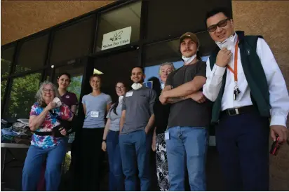  ?? PHOTOS BY KIMBERLY MORALES — ENTERPRISE-RECORD ?? Volunteers at the Shalom Free Clinic posed outside for a photo during their free, weekly clinic on Sunday, in Chico.