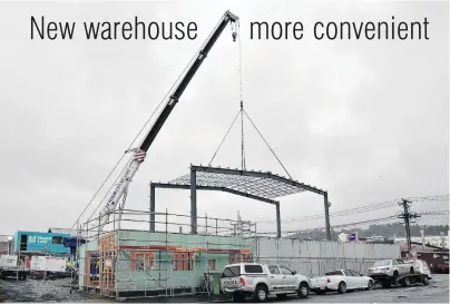  ?? PHOTO: GREGOR RICHARDSON ?? Wharf to Ward . . . A crane supports a frame in place at a constructi­on site in Ward St, Dunedin. Allied Pickfords will move in after the constructi­on work is completed in December.