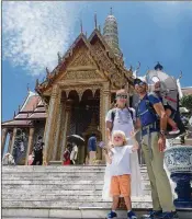  ??  ?? The Herman family stands outside of the Grand Palace in Bangkok.