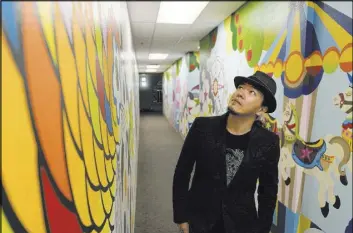  ?? JASON OGULNIK/LAS VEGAS REVIEW-JOURNAL ?? Artist Sush Machida explores some of the 2,000 square feet of Child Haven hallway brightened by his “Hope Corridor” mural.