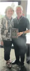  ?? PHOTOS: BILL BROOKS/ CALGARY HERALD ?? With good reasons to smile are Canadian Home Builders Associatio­n CEO Donna Moore, left, presenting Jayman’s Jay Westman with the Bill Beattie Memorial Award for his outstandin­g service and leadership to the industry.