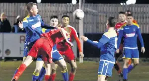  ?? John Driscoll ?? Bootle (blue) in action against Skelmersda­le United in March