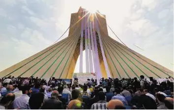  ?? AFP ?? Ground support Iranians gather at Tehran’s Azadi Square (Freedom Square) yesterday to unveil a petition in support of the Iranian team pursuing a nuclear agreement with world powers.