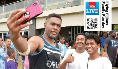  ??  ?? Fiji Airways Flying Fijians No.8 Viliame Mata takes a selfie with fans during the Family Fun Day at Albert Park, Suva on August 17, 2019.
Photo: Ronald Kumar