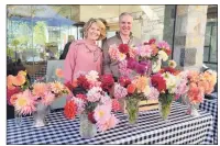  ?? Contribute­d photo / Laura McCormick / Greenwich Historical Society ?? Anne T. Getz, of Tower Flowers, joined by the Greenwich Historical Society’s Daniel Suozzo, attracted attention at a recent Tavern Garden Market with glorious dahlias taken from her Greenwich garden and design studio. The last Tavern Garden Market of the season will be offered Nov. 3.