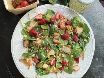  ?? GRETCHEN MCKAY — PITTSBURGH POST-GAZETTE/TNS ?? Fresh, local strawberri­es add a sweet touch to this easy spring salad with fried chicken.