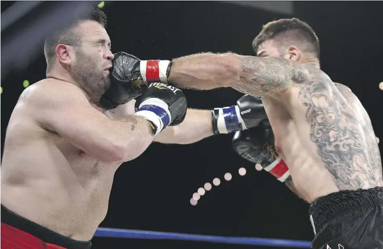  ?? ED KAISER ?? Adam Braidwood connects with Tim Hague’s jaw during the KO 79 boxing event at the Shaw Centre on June 16. Hague collapsed in the ring and died shortly after.