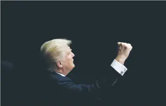  ?? (Reuters) ?? REPUBLICAN PRESIDENTI­AL nominee Donald Trump gestures to supporters as he departs a campaign rally in Iowa.