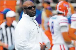  ??  ?? The Associated Press file Former Florida Gators assistant coach Tim Skipper, as seen in April 2015, has been hired as UNLV’S new defensive coordinato­r.