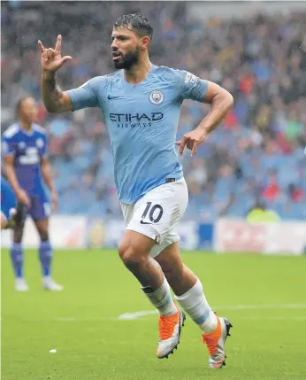  ?? Getty ?? Manchester City striker Sergio Aguero, making his 300th appearance for the club in all competitio­ns, celebrates after opening the scoring against Cardiff City yesterday