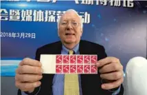  ??  ?? Chuck Hoey, former curator of Internatio­nal Table Tennis Federation Museum in Lausanne, Switzerlan­d, shows stamps issued by Sweden related to the sport.