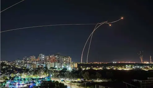  ?? ?? Israel's Iron Dome air defence system   res to intercept a rocket   red from the Gaza Strip, in Ashkelon, Israel, Tuesday, Oct. 17, 2023.