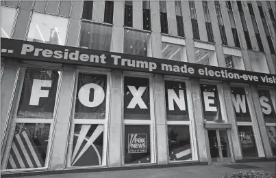  ?? MARK LENNIHAN, FILE AP PHOTO ?? A headline about President Donald Trump is displayed outside Fox News studios on Nov. 28, 2018, in New York. Attorneys for the cable news giant argued in a countercla­im unsealed Thursday that a $1.6 billion defamation lawsuit against Fox News by Dominion Voting Systems over the network’s coverage of the 2020 presidenti­al election is an assault on the First Amendment.